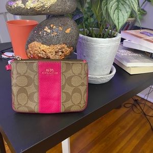 Small Coach change purse. Gently worn and slightly frayed.Interior slightly worn